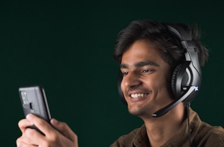 A friendly customer support agent wearing a headset, smiling and ready to assist.